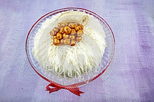 Banana cake sacakli yas pasta with white chocolate. on pink wooden background. pastry shop concept