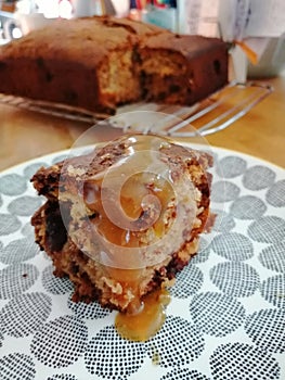 Banana cake with sultanas and chocolate chip and salted caramel sauce
