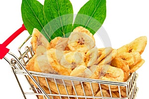 Banana chips with green leaves in metal trolley