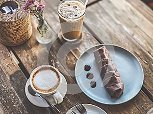 Banana chocolate cake with a hot coffee on table