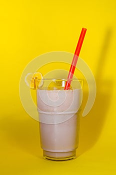 Banana and chocolate milkshake in the glass cup