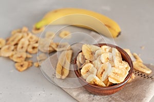 Banana - This is a close up shot of a bowl full of dried banana chips. Shot with a shallow depth of field and vignetting