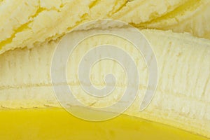 Banana closeup showing endocarp edible part and peeled back skin