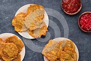 Banana Fritters on plates with coloured napkins