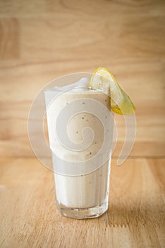 Banana Fruit shake with a piece of banana on top for decor