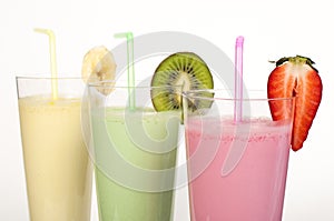 Banana, kiwi and strawberry milk shake and fresh fruis