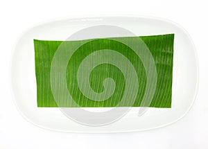 Banana leaf on blank plate