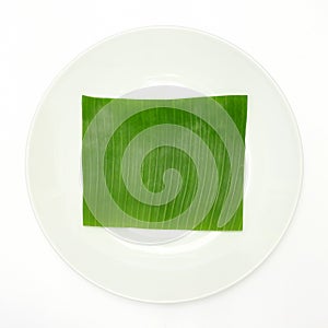 Banana leaf on blank plate