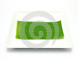 Banana leaf on blank plate