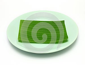 Banana leaf on blank plate