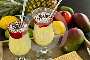 Banana and mango smoothie dessert in wine glasses