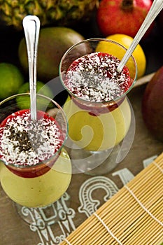 Banana and mango smoothie dessert in wine glasses