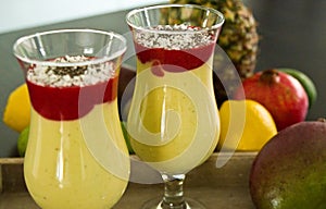 Banana and mango smoothie dessert in wine glasses