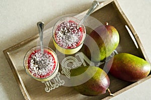 Banana and mango smoothie dessert in wine glasses