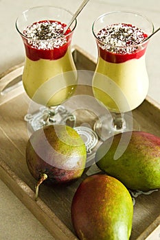 Banana and mango smoothie dessert in wine glasses