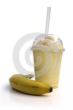 Banana Milkshake with fruit in disposable plastic container straw Take Away Fast Food