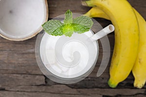 Banana mixed coconut smoothie white fruit juice milkshake blend beverage healthy.