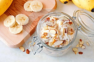 Banana nut overnight oats in glass canning jar, downward view