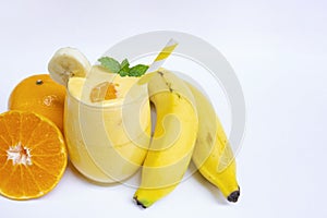 Banana and orange smoothies yellow colorful fruit juice milkshake blend beverage healthy high protein the taste yummy.