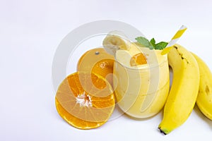 Banana and orange smoothies yellow colorful fruit juice milkshake blend beverage healthy high protein the taste yummy .