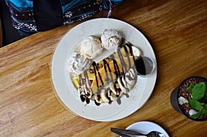 Banana pancake with ice cream and chocolate topping