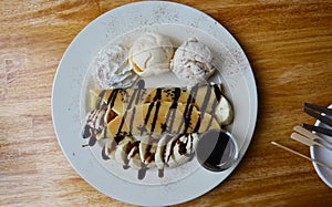 Banana pancake with ice cream and chocolate topping
