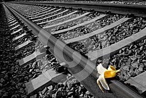 Banana peel on railway. Train Sabotage humoristic conceptual image