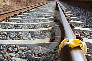 Banana peel on railway. Train Sabotage humoristic conceptual image