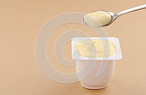 Banana pudding cup plastic on brown background