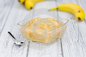 Banana Puree on wooden background