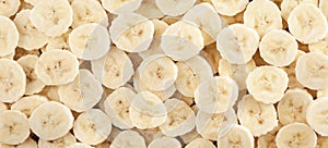 Banana slices. Background and texture. Panorama.