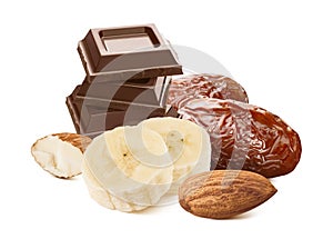 Banana slices, dates, almonds and milk chocolate isolated on white background