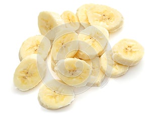 Banana slices on white photo