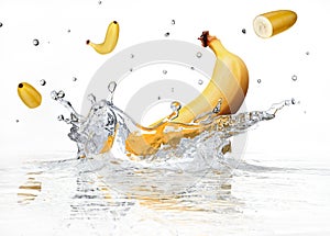 Banana splashing into clear water.