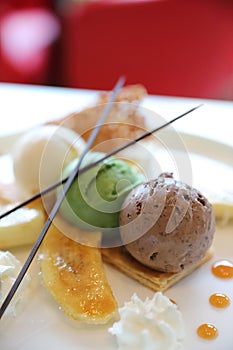 Banana split sundae ice cream on a plate