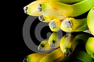 Banana on the tray on dark background.