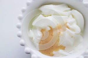 Banana and vanilla condense milk in yogurt bowl