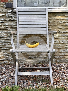 Banana on wooden garden chair