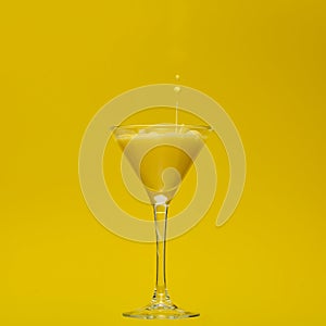 Banana Yellow Cocktail with splash droplet in a yellow setting