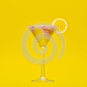 Banana Yellow Cocktail with strawberry marbling in a yellow setting
