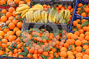 Banana yellow and orange tangerines photo