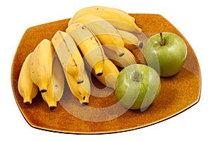 Bananas and apples on the dish