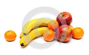 Bananas, apples and tangerines on a white background