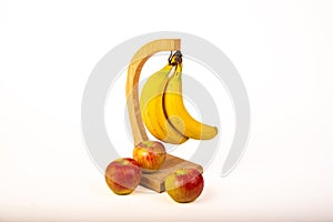 Bananas and apples on white background.