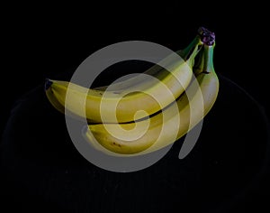 Bananas on black background