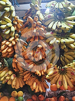 Bananas on display for sale in a traditional market, closed