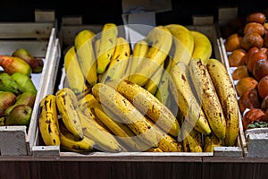 bananas in the fruit section, Bunch of ripened bananas at grocery store