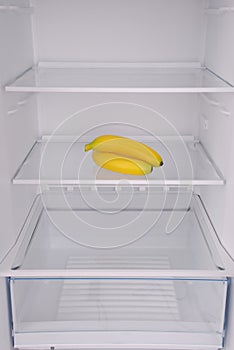 Bananas inside in empty clean refrigerator