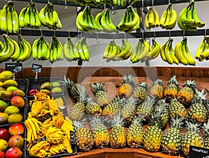 Bananas and Pineapples on Display Grocery Store