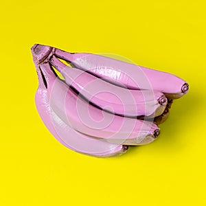 Bananas in pink paint. Surreal minimal art